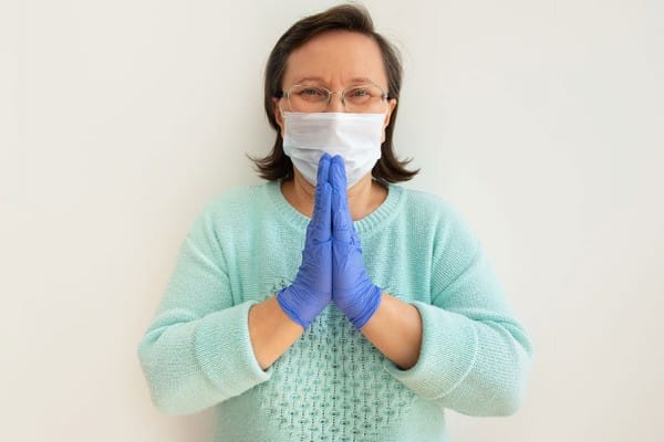 woman wearing mask and gloves