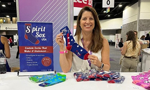 Sock Queen Lisa Riggs at a tradeshow