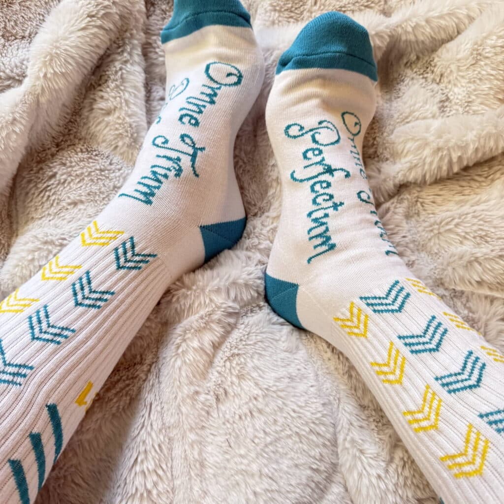 a pair of promotional custom branded socks for Owen Trims Perfectrim