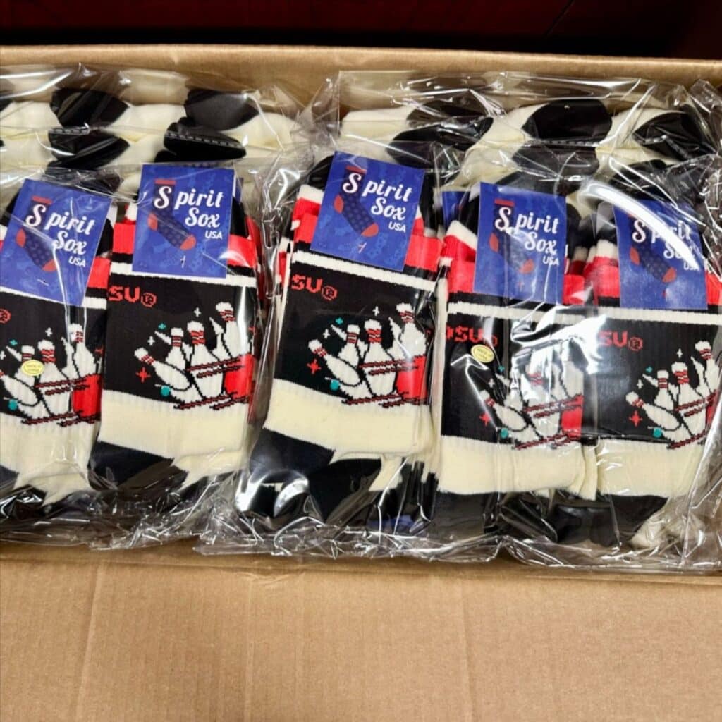 a box of custom socks from spirit sox for companies, sports teams, and organizations