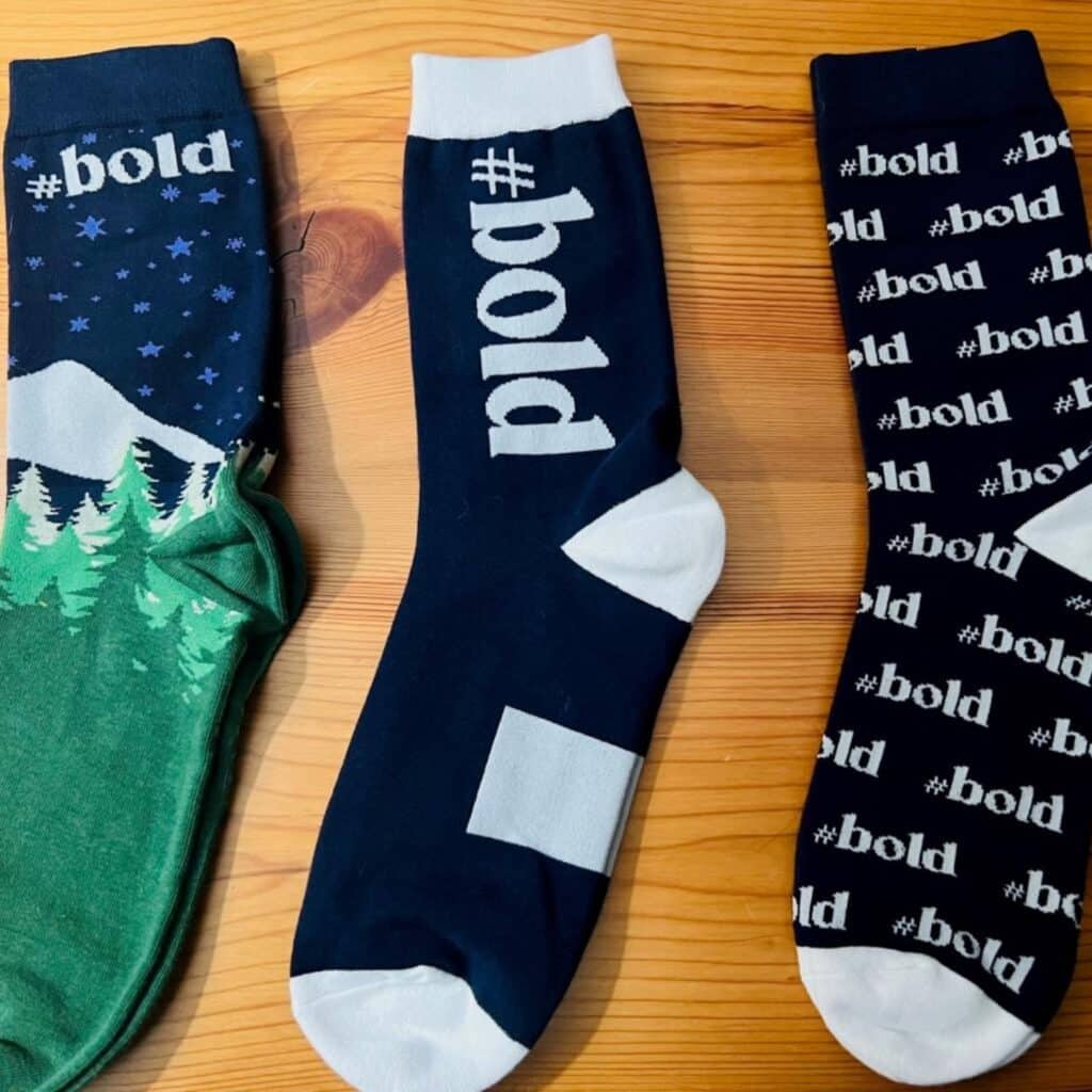 three pairs of custom branded socks laid out side by side