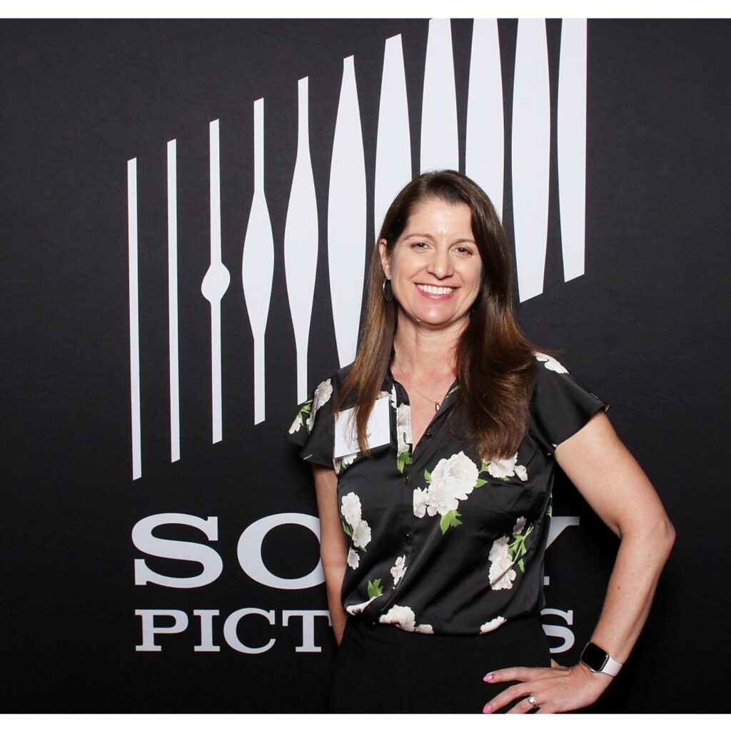 spiritsox owner lisa riggs at sony pictures global supplier of the year award ceremony with a sony backdrop