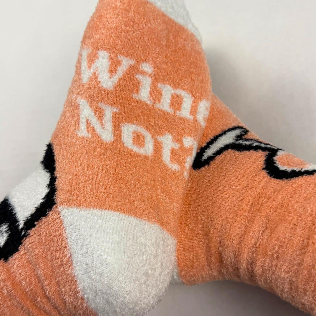 orange custom fuzzy socks with logo and slogan