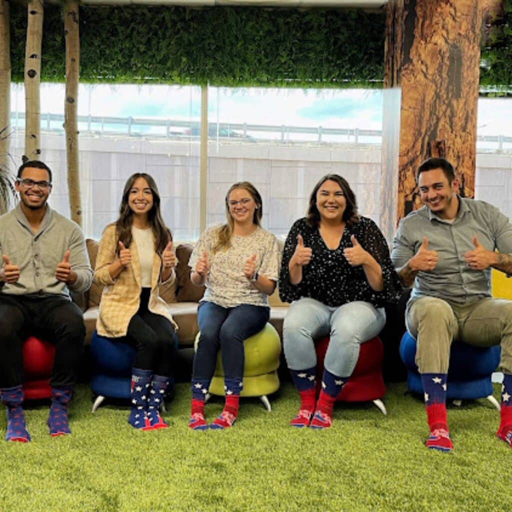a company crew wearing custom socks by spirit sox