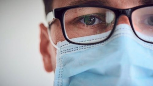 man with glasses and face mask